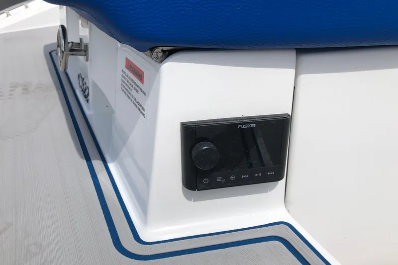 Slide: The Image of Control panel on a 2021 Cobalt CS22 boat with blue seating. - 27