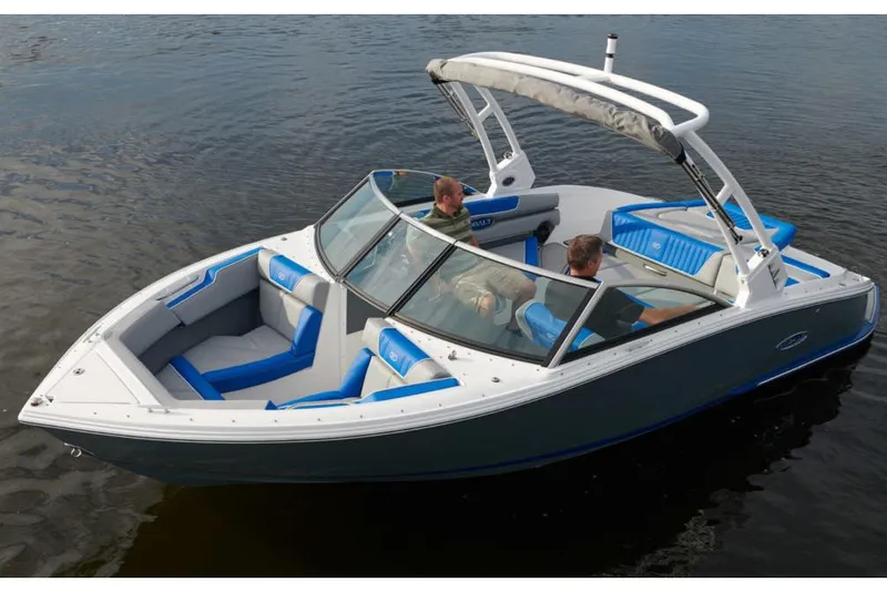 Slide: The Image of Manufacturer Provided Image: 2021 Cobalt CS22 boat on water with blue and white interior. - 28