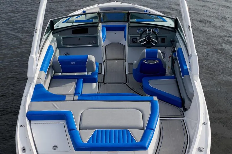 Slide: The Image of Manufacturer Provided Image: 2021 Cobalt CS22 boat interior with blue and gray seating on water. - 8