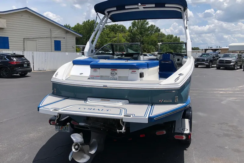 Slide: The Image of 2021 Cobalt CS22 boat parked outdoors, showcasing sleek design and modern features. - 9