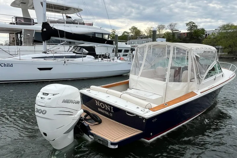 Slide: The Image of 2018 Hunt Yachts Harrier 25 with Mercury 300 engine docked in marina. - 11