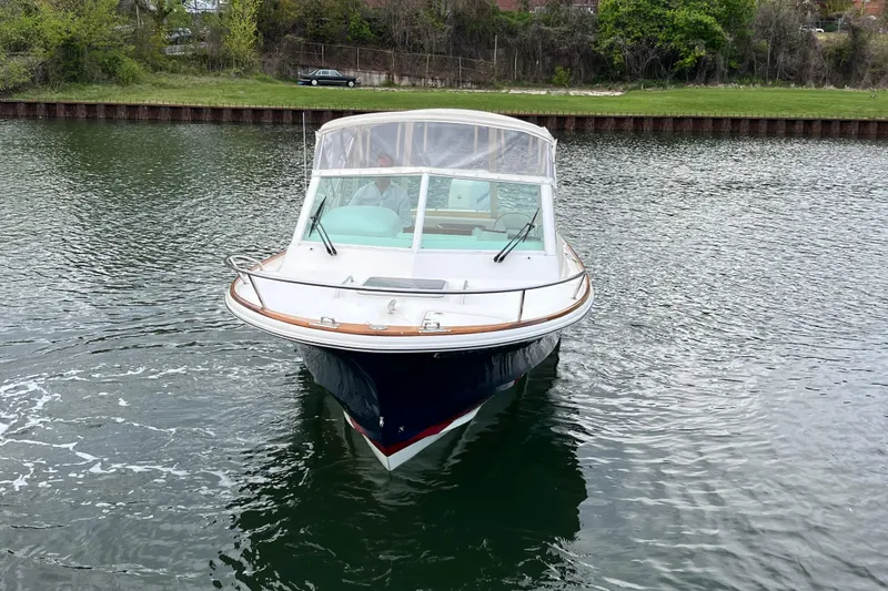 Slide: The Image of 2018 Hunt Yachts Harrier 25 cruising on a calm river. - 7