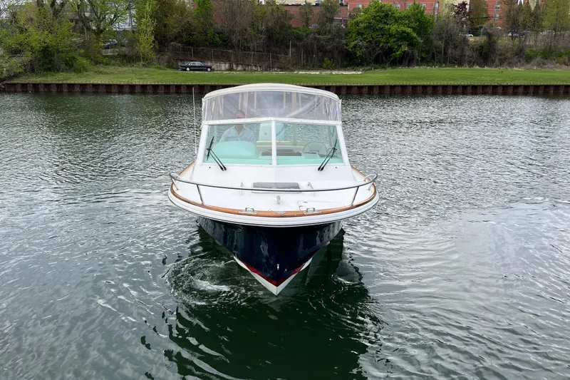 Slide: The Image of 2018 Hunt Yachts Harrier 25 cruising on a calm river. - 8