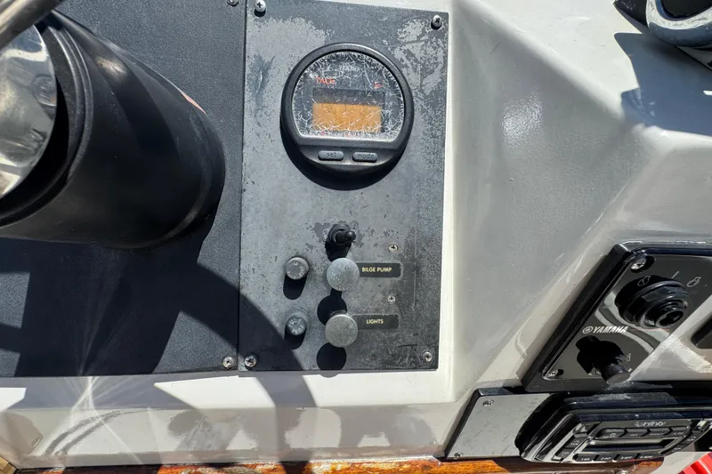 Slide: The Image of Dashboard of a 1988 Boston Whaler 170 Montauk boat with controls and gauges. - 5