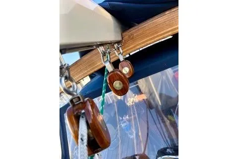 Slide: The Image of Wooden pulleys on a 1981 Ta-Shing Panda 40 sailboat. - 11