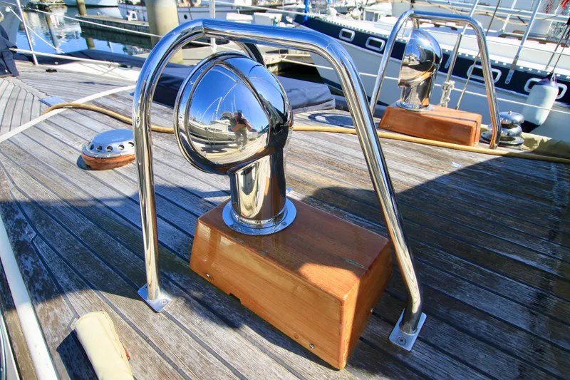 Slide: The Image of Polished metal fittings on 1981 Ta-Shing Panda 40 yacht deck, reflecting marina surroundings. - 23