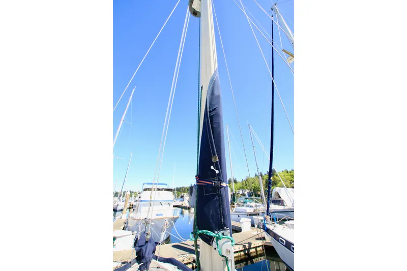 Slide: The Image of 1981 Ta-Shing Panda 40 sailboat mast in marina, clear blue sky background. - 26