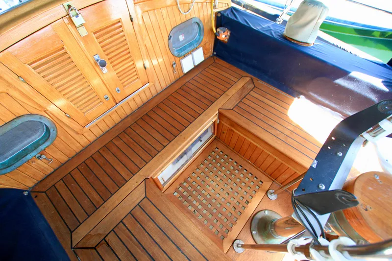 Slide: The Image of Wooden interior of 1981 Ta-Shing Panda 40 sailboat, featuring teak flooring and cabinetry. - 29