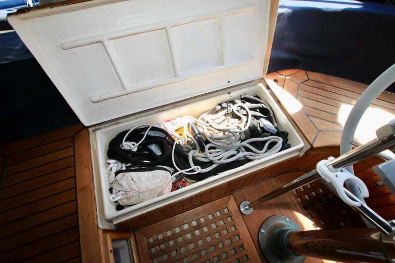 Slide: The Image of Open storage compartment on 1981 Ta-Shing Panda 40 sailboat, containing ropes and nautical gear. - 35