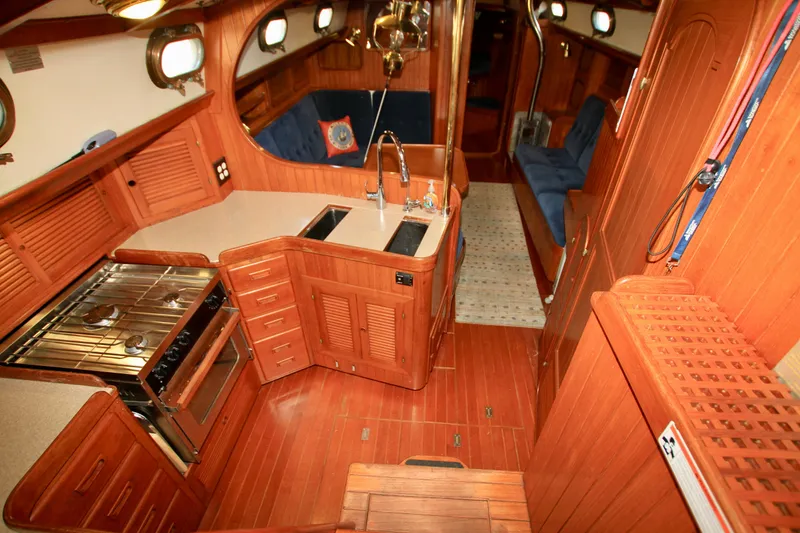 Slide: The Image of Interior of 1981 Ta-Shing Panda 40 yacht with wooden cabinetry and kitchen area. - 36