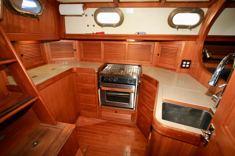 Slide: The Image of Wooden interior of 1981 Ta-Shing Panda 40 yacht kitchen with stove and sink. - 38