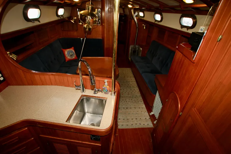 Slide: The Image of Interior of 1981 Ta-Shing Panda 40 yacht with wooden finish and cozy seating. - 39