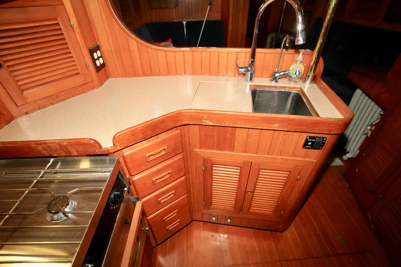 Slide: The Image of Wooden galley interior of 1981 Ta-Shing Panda 40 yacht with sink and stove. - 42