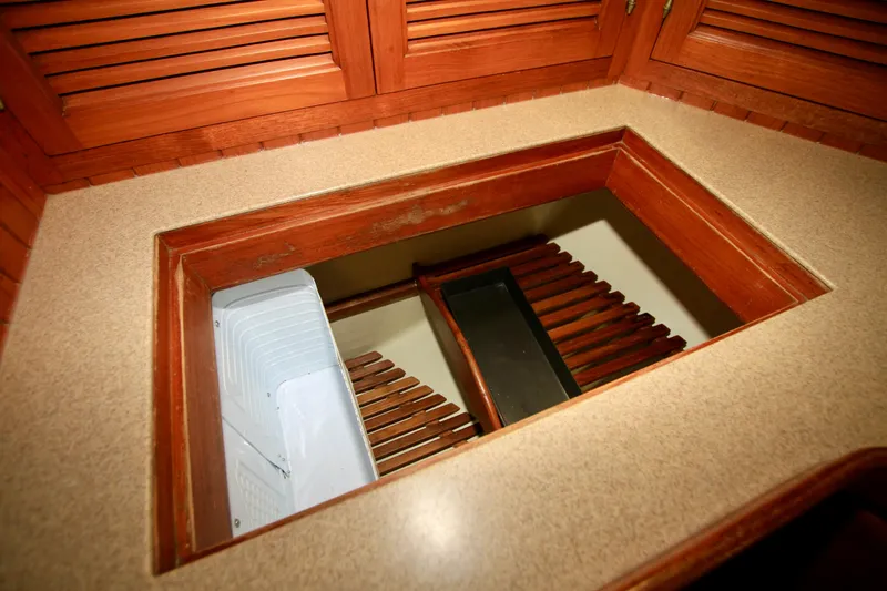 Slide: The Image of Interior view of 1981 Ta-Shing Panda 40 yacht with wooden cabinetry and storage compartment. - 43
