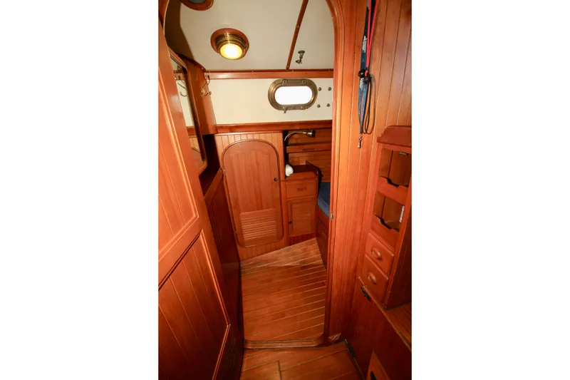 Slide: The Image of Interior of 1981 Ta-Shing Panda 40 sailboat with wooden cabinetry and porthole. - 47