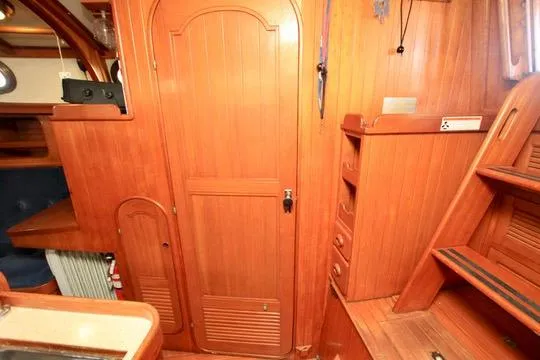 Slide: The Image of Interior of 1981 Ta-Shing Panda 40 sailboat with wooden cabinetry and stairs. - 48