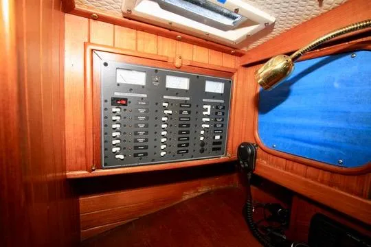Slide: The Image of Electrical panel inside 1981 Ta-Shing Panda 40 yacht, featuring switches and gauges. - 54