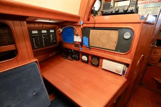 Slide: The Image of Navigation station of 1981 Ta-Shing Panda 40 yacht with wooden interior and control panels. - 56