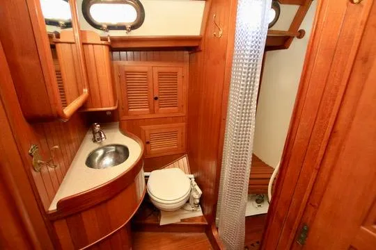 Slide: The Image of 1981 Ta-Shing Panda 40 yacht bathroom with wooden interior and compact design. - 57