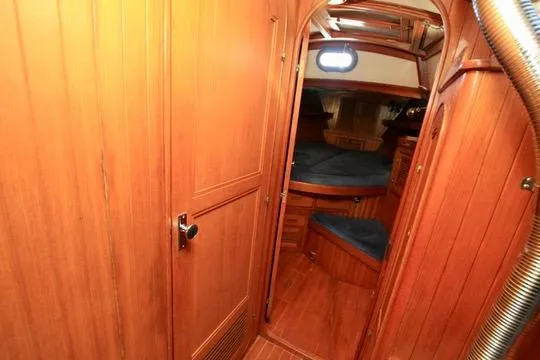 Slide: The Image of Interior of 1981 Ta-Shing Panda 40 sailboat with wooden paneling and cozy cabin. - 58
