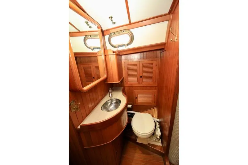 Slide: The Image of Wood-paneled bathroom in 1981 Ta-Shing Panda 40 yacht with sink and toilet. - 63
