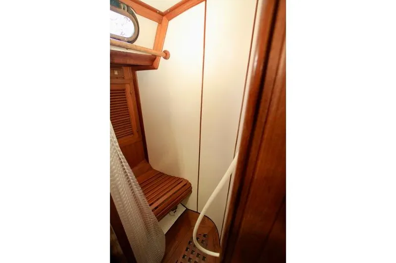 Slide: The Image of Interior of 1981 Ta-Shing Panda 40 sailboat, featuring wooden shower area. - 64