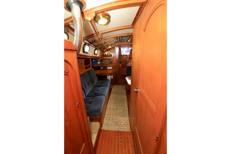 Slide: The Image of Interior of 1981 Ta-Shing Panda 40 sailboat with wooden finish and blue seating. - 67