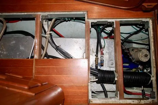 Slide: The Image of Engine compartment of a 1981 Ta-Shing Panda 40 sailboat, showing wiring and components. - 69