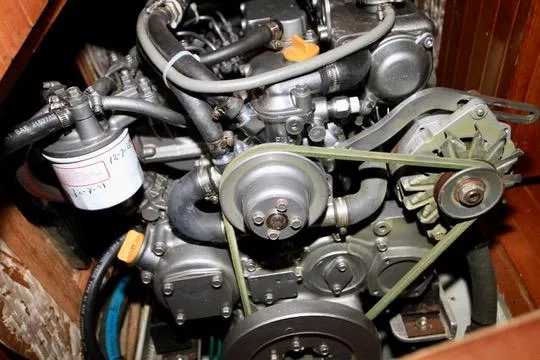 Slide: The Image of Engine of a 1981 Ta-Shing Panda 40 sailboat, showcasing mechanical components and belts. - 71