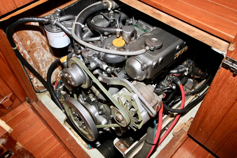 Slide: The Image of Engine compartment of a 1981 Ta-Shing Panda 40 sailboat, showcasing mechanical components. - 73