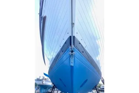 Slide: The Image of Front view of a 1981 Ta-Shing Panda 40 sailboat with a blue hull. - 77