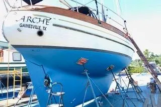 Slide: The Image of 1981 Ta-Shing Panda 40 sailboat on stands, Gainesville, TX, with blue hull. - 78