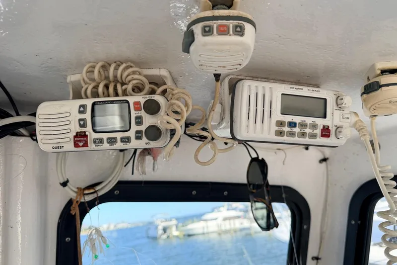 Slide: The Image of Interior of a 1997 H&H Marine 38 boat with marine radios and microphones. - 10
