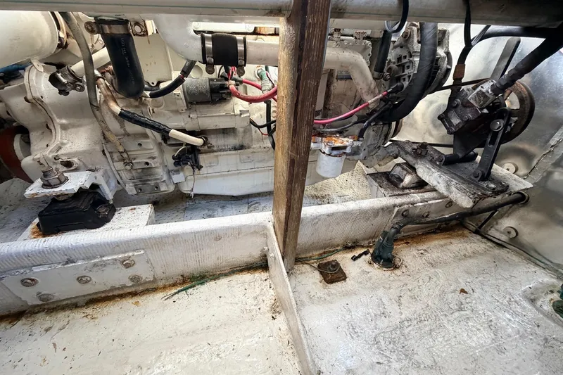 Slide: The Image of Engine compartment of a 1997 H&H Marine 38 boat, showing mechanical components and wiring. - 15