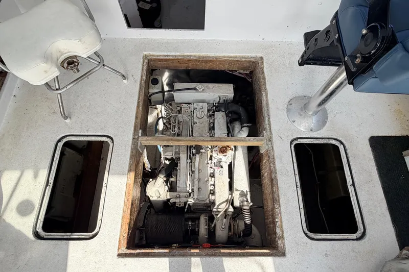 Slide: The Image of Engine compartment of a 1997 H&H Marine 38 boat, showing detailed mechanical components. - 16