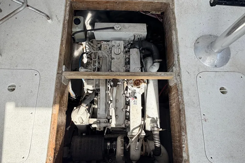 Slide: The Image of Engine compartment of a 1997 H&H Marine 38 boat, showcasing mechanical components. - 17