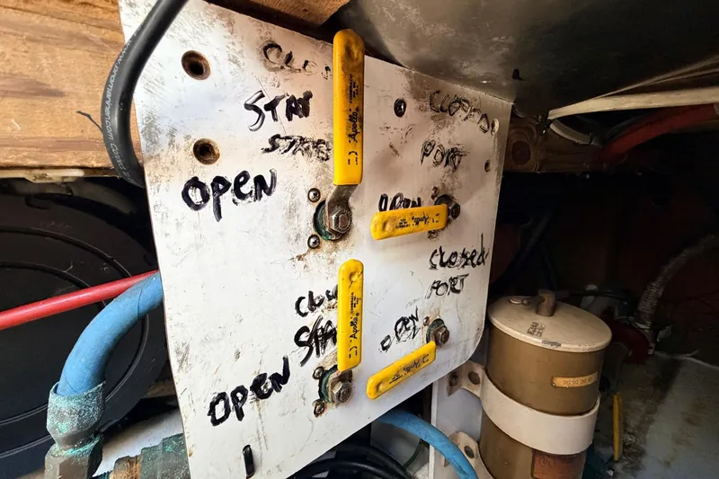 Slide: The Image of Control panel with labeled levers and pipes on a 1997 H&H Marine 38 boat. - 20