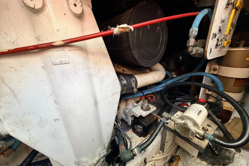 Slide: The Image of Engine compartment of a 1997 H&H Marine 38 boat, featuring various mechanical components. - 21