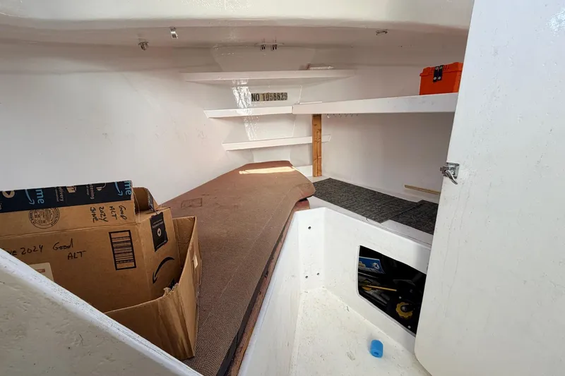 Slide: The Image of Interior of a 1997 H&H Marine 38 boat with storage and shelving. - 23