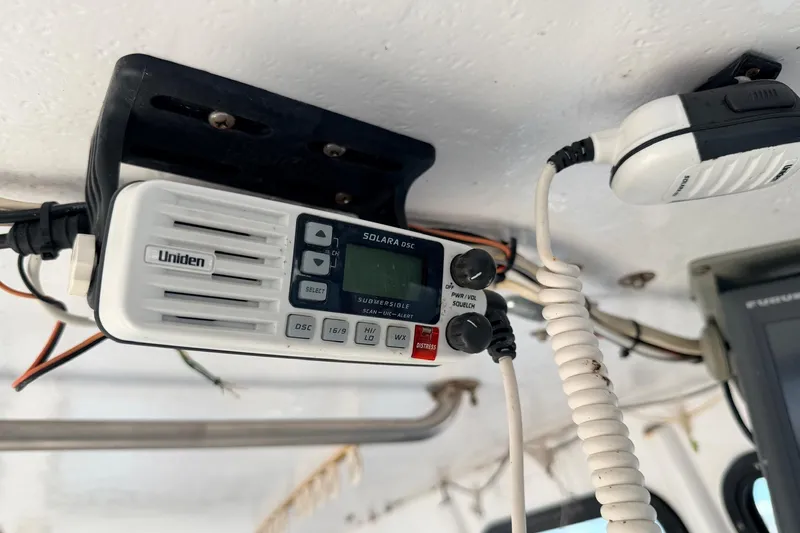 Slide: The Image of Marine radio equipment inside a 1997 H&H Marine 38 boat cabin. - 27