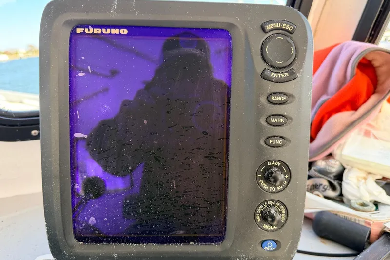 Slide: The Image of Furuno marine navigation device on H&H Marine 38, 1997 model, with visible controls. - 28