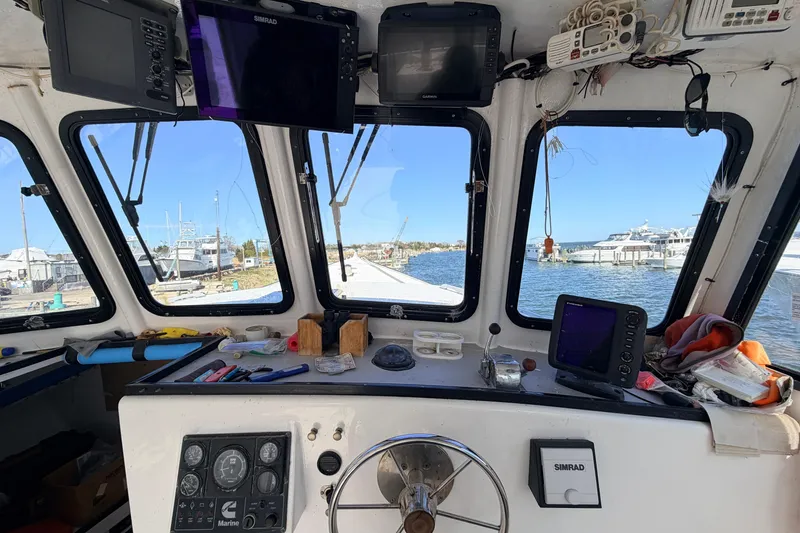 Slide: The Image of Interior view of a 1997 H&H Marine 38 boat cockpit with navigation equipment. - 3