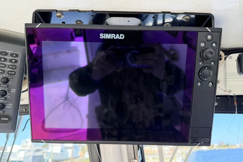 Slide: The Image of Simrad marine display on a 1997 H&H Marine 38 boat dashboard. - 30