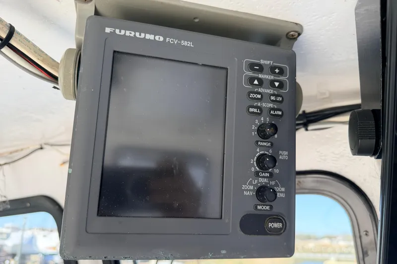 Slide: The Image of Furuno FCV-582L marine display on a 1997 H&H Marine 38 boat. - 31