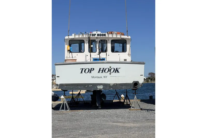 Slide: The Image of H&H Marine 38 boat, "Top Hook," docked in Montauk, NY, 1997 model. - 33