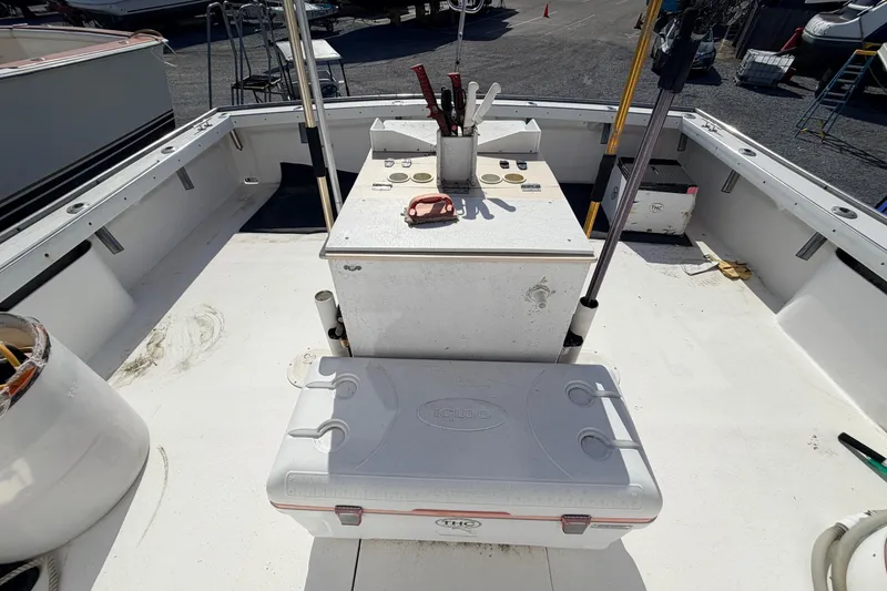 Slide: The Image of Deck of 1997 H&H Marine 38 boat with cooler and fishing gear. - 34