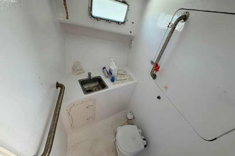Slide: The Image of Compact marine bathroom with sink and toilet in 1997 H&H Marine 38 boat. - 39
