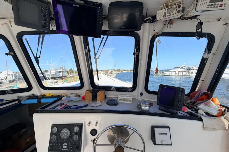 Slide: The Image of Interior view of a 1997 H&H Marine 38 boat cockpit with navigation equipment. - 4