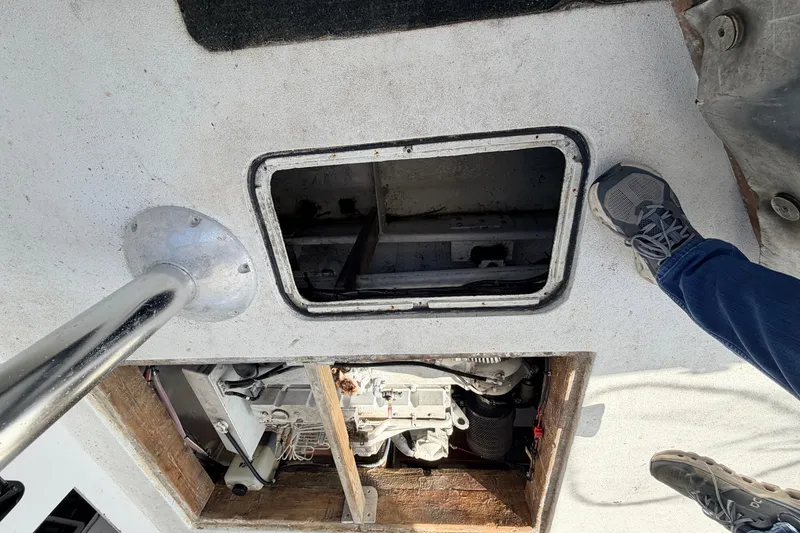 Slide: The Image of Open hatch on 1997 H&H Marine 38 boat deck, revealing engine compartment. - 40