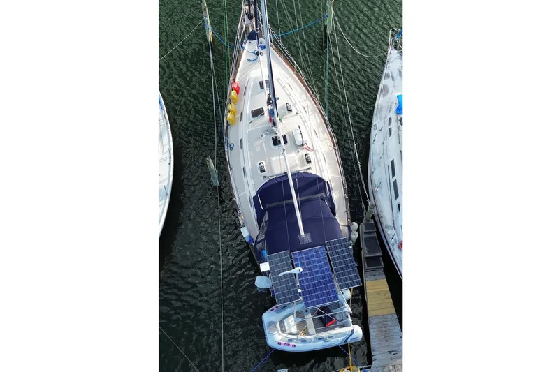 Slide: The Image of Overhead view of a 2002 Island Packet 380 sailboat docked, featuring solar panels. - 13